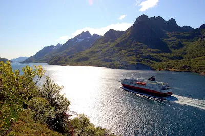 Sailing through Norway's Raftsundet strait on a glorious autumn day aboard the Hurtigruten expedition ship Richard With.