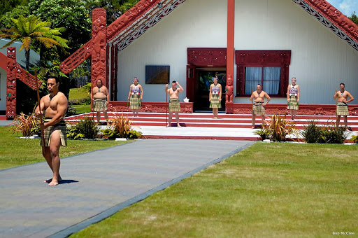 Traditional_Maori_welcome_Rotorua - Preserving traditional Maori culture and customs often involves sharing authentic experiences with visitors to New Zealand. At Te Puia in Rotorua, guests are welcomed onto the marae (tribal meeting place) in the traditional manner and in front of the wharenui (sacred meeting house). After taking part in the powhiri (welcoming ceremony), you are forever linked to the marae.