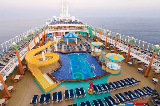 Norwegian-Jewel-Sapphire-Pool - The Sapphire Pool is Norwegian Jewel's main pool area. There's also a kid's pool, a hot tub, lounge chairs, a grill and splendid views.