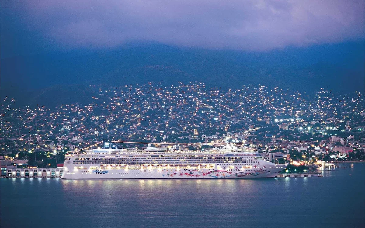 Norwegian-Star-Acapulco-night - Party on Norwegian Star's deck while it's docked in Acapulco, the largest beach and resort town in Mexico.