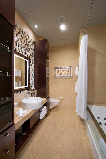 You will love Celebrity Reflections' marble clad Signature Suite bathroom with its own jet-powered bath and plenty of storage.