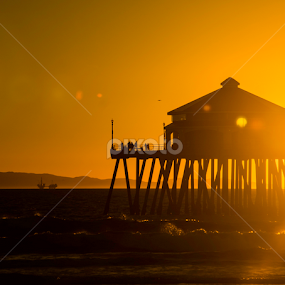 Rudy's bar at Huntington Beach Pier at sunset by Robie Blair - Landscapes Beaches