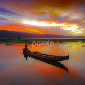A Man On Boat at Limonto by Andrial Kusuma - Landscapes Sunsets & Sunrises