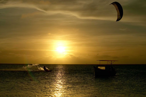 sunset-sailboard-Aruba - A sailboarder at sunset on Aruba.