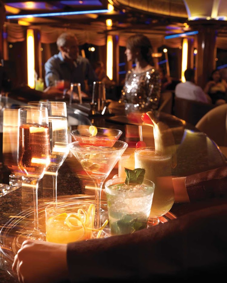 Venture into the Yacht Club aboard Queen Elizabeth for a quiet respite during the day and evening entertainment and dancing on its compass-shaped dance floor.