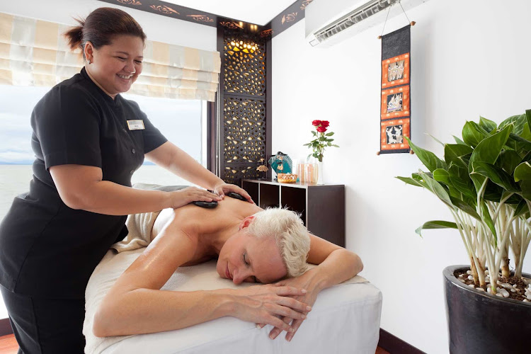 Indulge in a comforting traditional hot stone massage as you make your voyage down the Mekong River aboard AmaLotus.