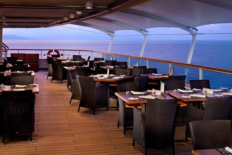 Watch the sunset on the outside deck by dining at the Colonnade aboard Seabourn Sojourn.