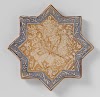 Star-shaped tile with hares among floral scrolls