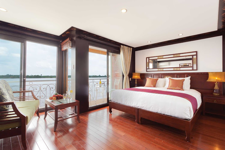 A twin balcony junior suite aboard AmaLotus with a décor that combines colonial elegance with regional Khmer accents. Suites feature large sitting areas, air-conditioning, mini-bar, safety deposit box and a bathtub.