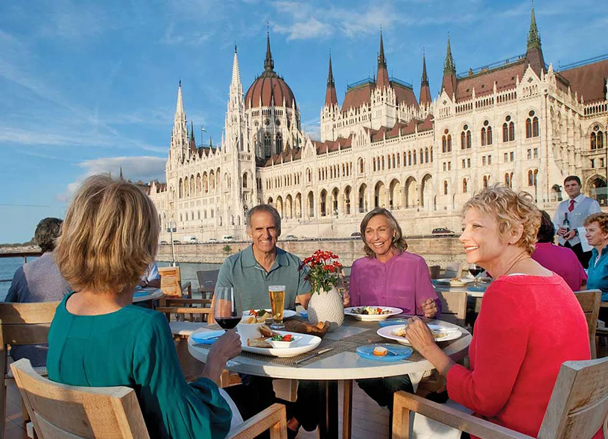 Viking-Longship-Aquavit-dining-in-Budapest - Have lunch on the deck of your Viking Longship while taking in the impressive architecture of the Parliament building in Budapest and other storied cities along the Danube.