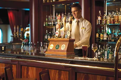 Choose from a wide assortment of brews on tap at the Golden Lion Pub aboard Queen Mary 2.