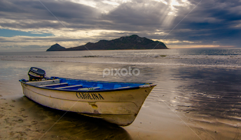 Boat on Mazatlan Shore by Gary Hanson - Transportation Boats