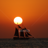 Sailing at Sunset by Tony Moore -  