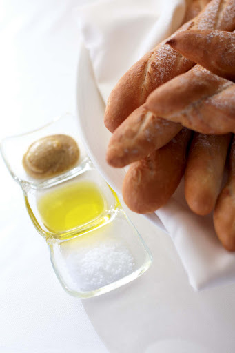Enjoy an array of fresh-baked breads and an assortment of tasty dips while dining on a Crystal cruise.