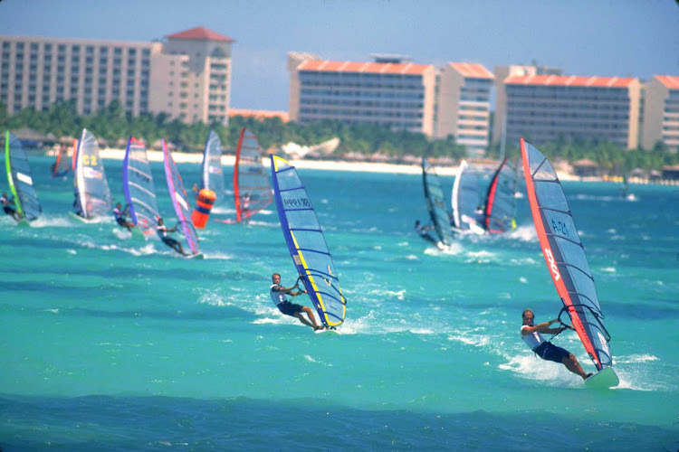 A squadron of windsurfers on Aruba.