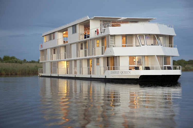 Take a river safari aboard the Zambezi Queen to see wildlife and take in the rustic vistas along Africa's Chobe River. 