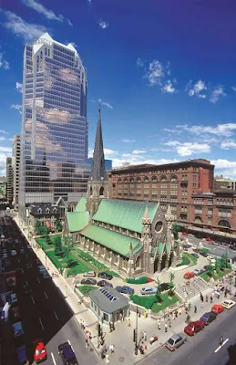 Christ Church Cathedral juxtaposed against a skyscraper in Montreal.