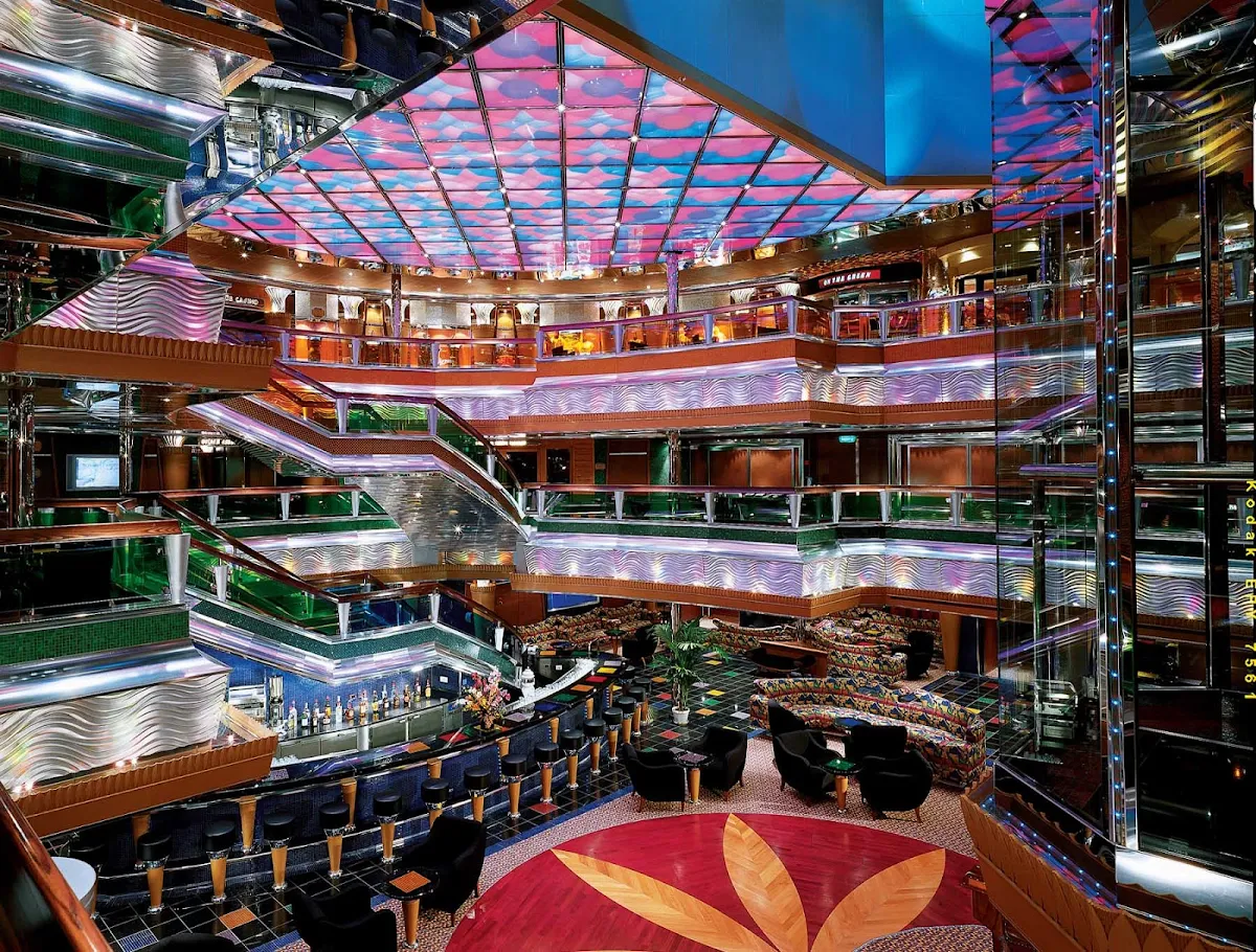 Carnival-Glory-Colors-Lobby - Stroll through a multi-deck kaleidoscope in Carnival Glory's Colors Lobby.