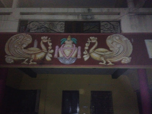 Golden Pot and Peacock Mural on Wall 