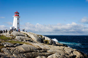Hurtigruten guests pay a shore excursion to Peggy's Cove Lighthouse on the eastern shore of St. Margarets Bay in Halifax, Nova Scotia. The lighthouse dates to 1868. 