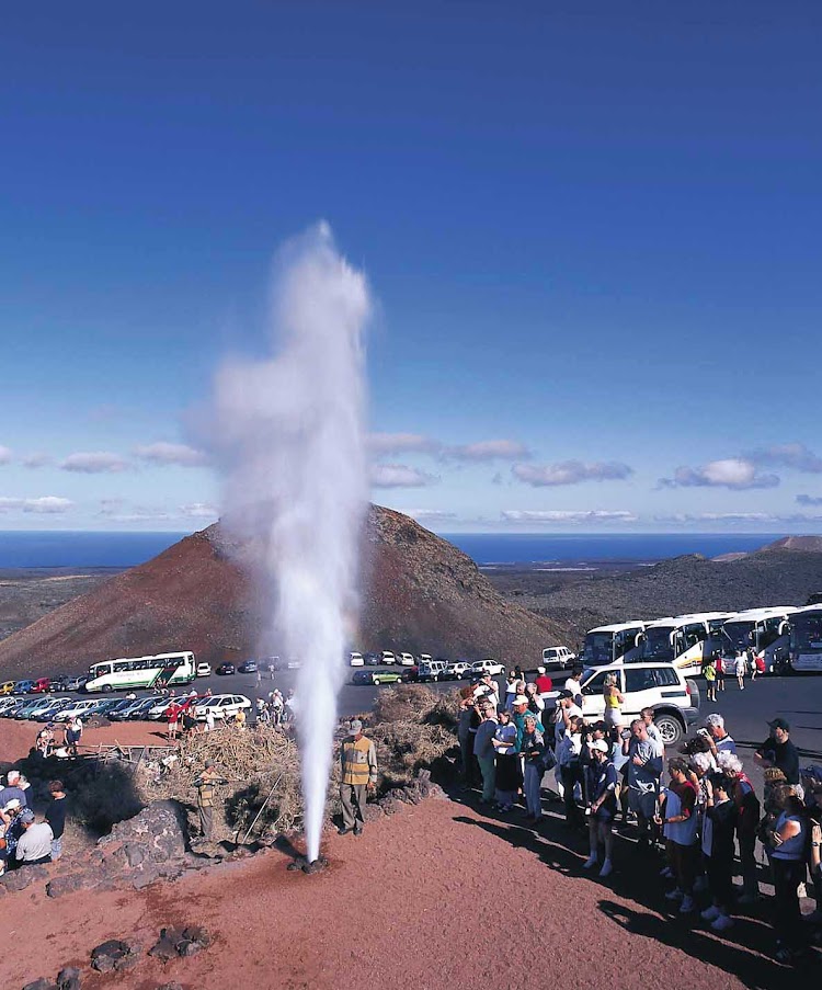 A geyser shoots off at Parque Nacional de Timanfaya in Tinajo  on the island of Lanzarote in Las Palmas province in Spain's Canary Islands.