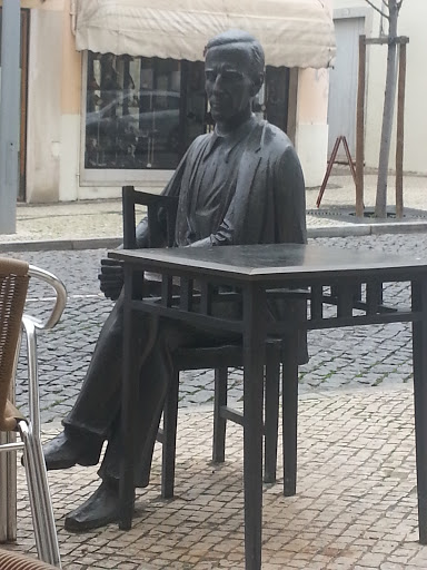 Man Sitting at Table