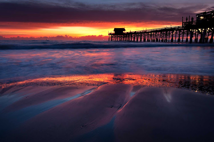 Take a romantic stroll along Cocoa Beach, Florida, when your cruise ship docks at nearby Port Carnival.