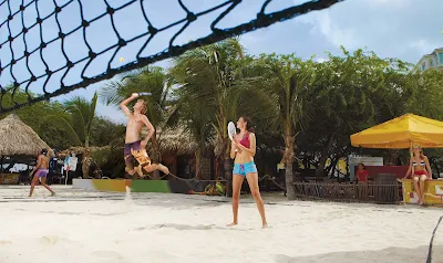 Burn some calories playing paddleball on the beach in Aruba.