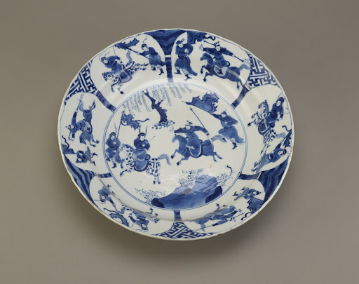 Plate with design of battling warriors, one of a pair with F1992.15.2