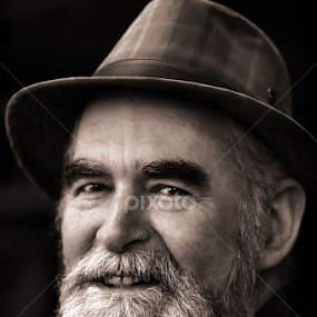 Man in a Tartan Hat by Julien Johnston - Black & White Portraits & People