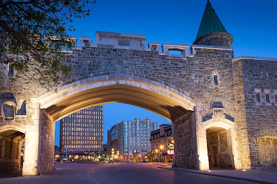 The historic fortifications of Quebec City stand in contrast to its modern cityscape. 