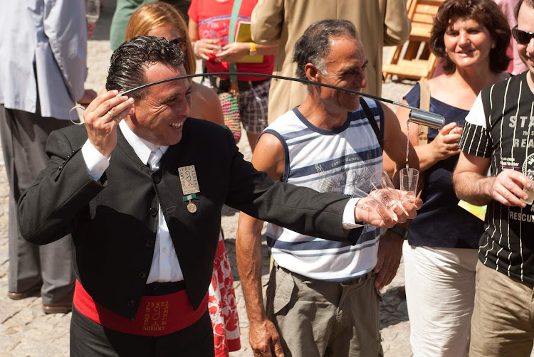 A street scene in Jerez de la Frontera in the Andalusia region of southern Spain during Harvest Festival, the celebration of fall harvest inspired by wine and held every September.