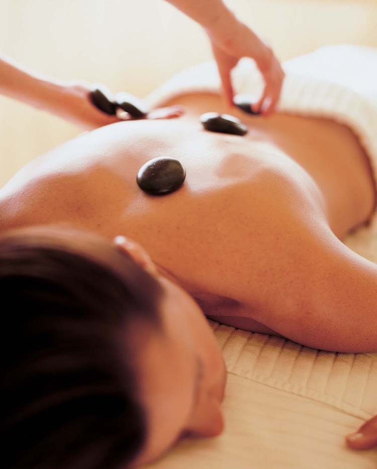 Try a stone massage in the spa on the Crystal Serenity to unwind at sea.