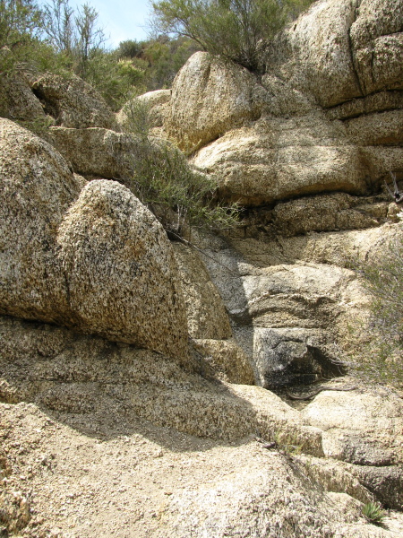 A bit of eroded rock shows where water often flows, at least when it rains.
