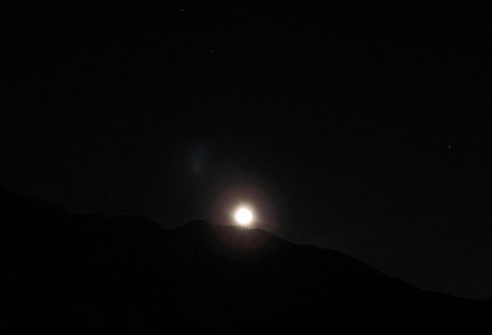 The moon rising above the local hills seen from Echo Mountain.