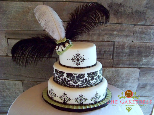 For the design of this three tier oval black damask pattern gave dramatic