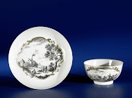 Straight-sided cup and saucer with European landscapes in panels