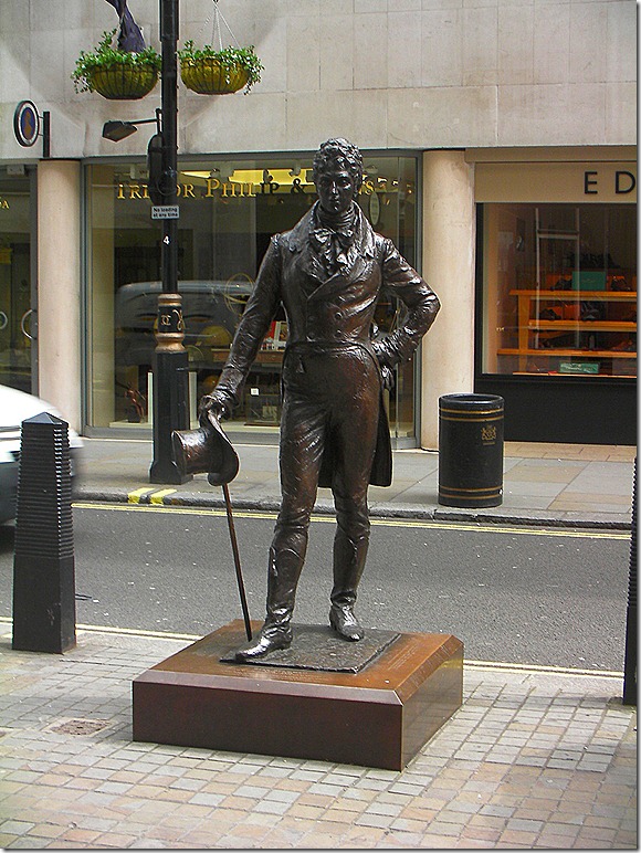 George Bryan “Beau” Brummell.  English 19th-century men’s style icon.  Innovator of the modern men’s suit.  His statue on Jermyn Street in St. James, London.