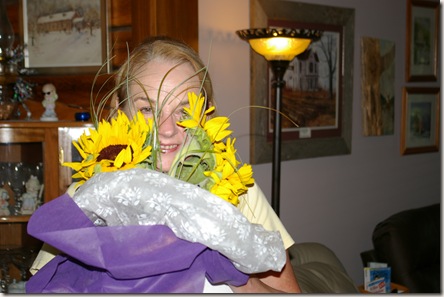 Deanna holding sunflowers