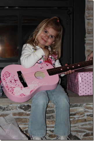 Reagan playing her guitar