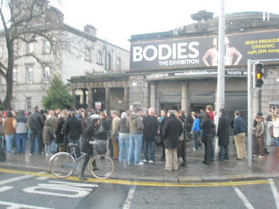 Photo shows exterior of Ambassador Theatre, Dublin with perhaps 50 people queing outside BODIES: the exhbition