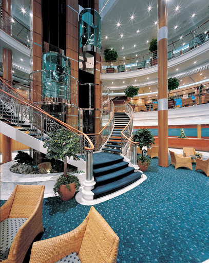 The Norwegian Sun's sparkling Atrium features a contemporary design combining glass, wood and metal elements. 
