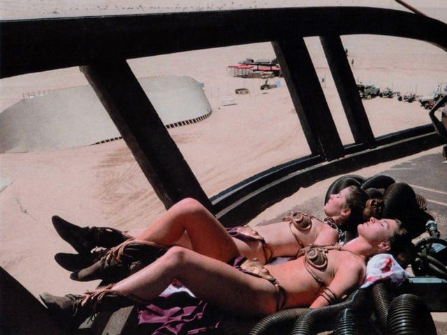 [on-set shot of Carrie Fisher near naked in her  Leia bikini along with her stunt double getting some sun during the filming of Return of the Jedi[10].jpg]