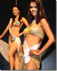 Miss India Esha Gupta (R) poses in swimwear during the Miss International Beauty Pageant press conference in Tokyo, October 03, 2007