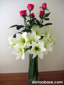 Pink roses and lilies in one vase