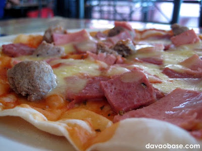 Closeup of Fantastico (meatlovers) pizza at Mamma Maria's Pizzeria