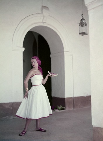 [Model is wearing a strapless white cotton dress with a matching headkerchief, by Pat Premo and sandals by Bernardo 1953[4].jpg]