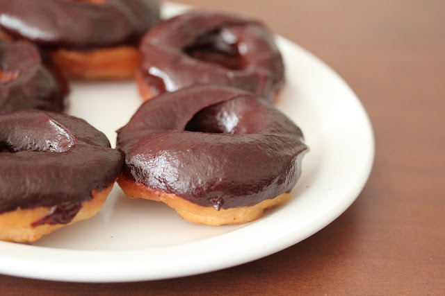 close-up photo of chocolate glazed donuts