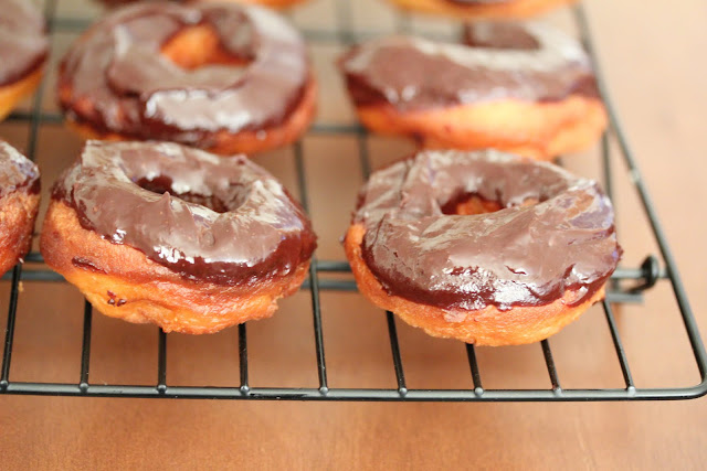photo of glazed donuts on a baking rack
