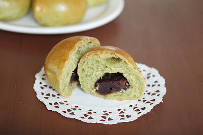 a match bread roll sliced in half on a paper doily